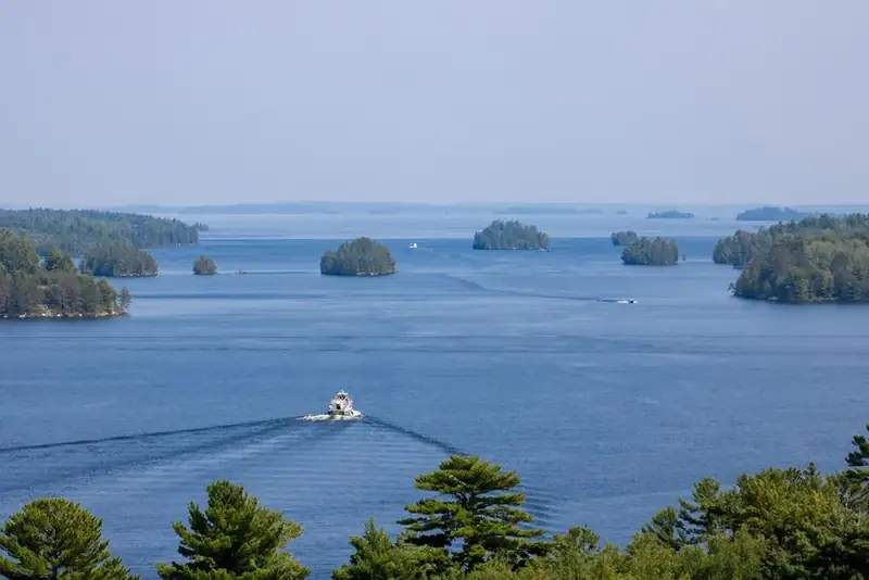 The Voyageur tour boat can be seen traveling into a vast expanse of lakes and islands